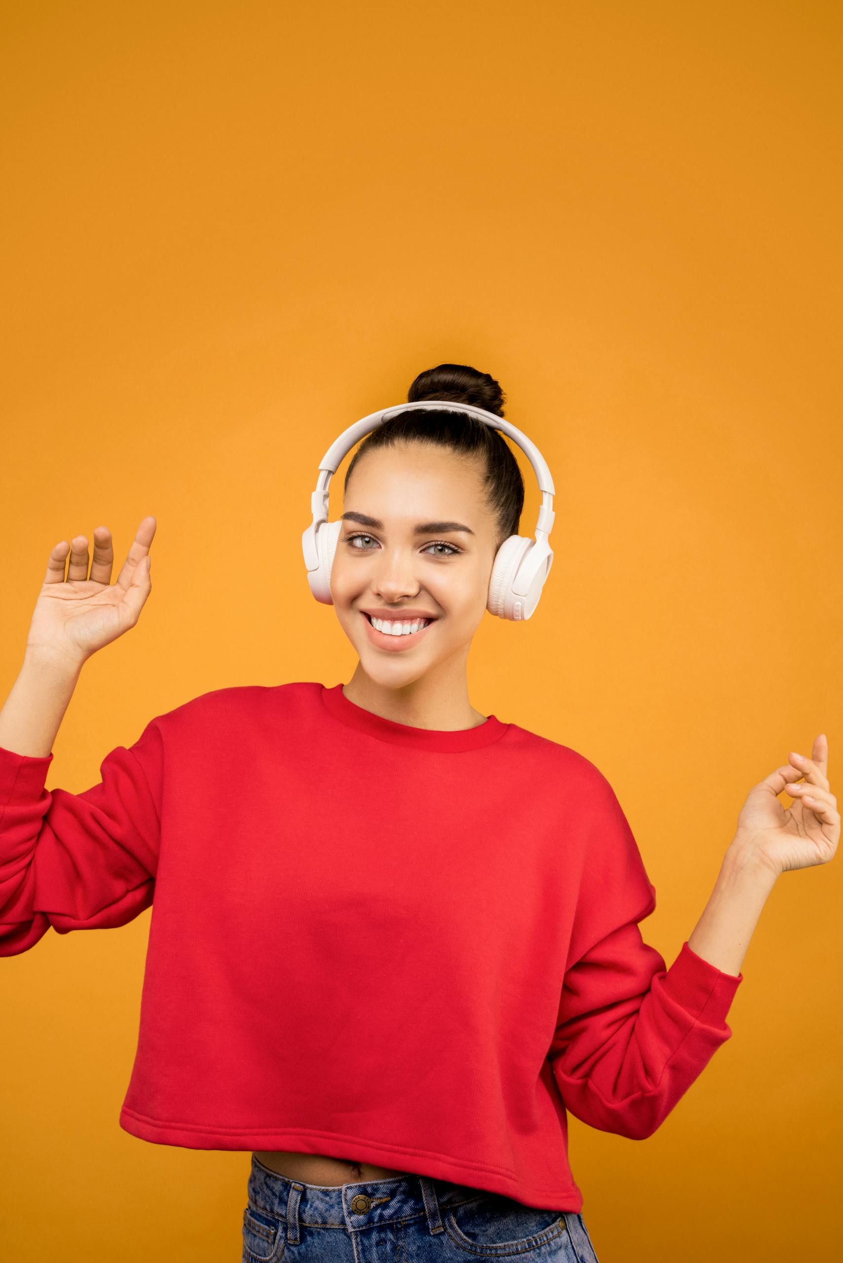Medical student smiling with headphones, symbolizing flexible learning formats
